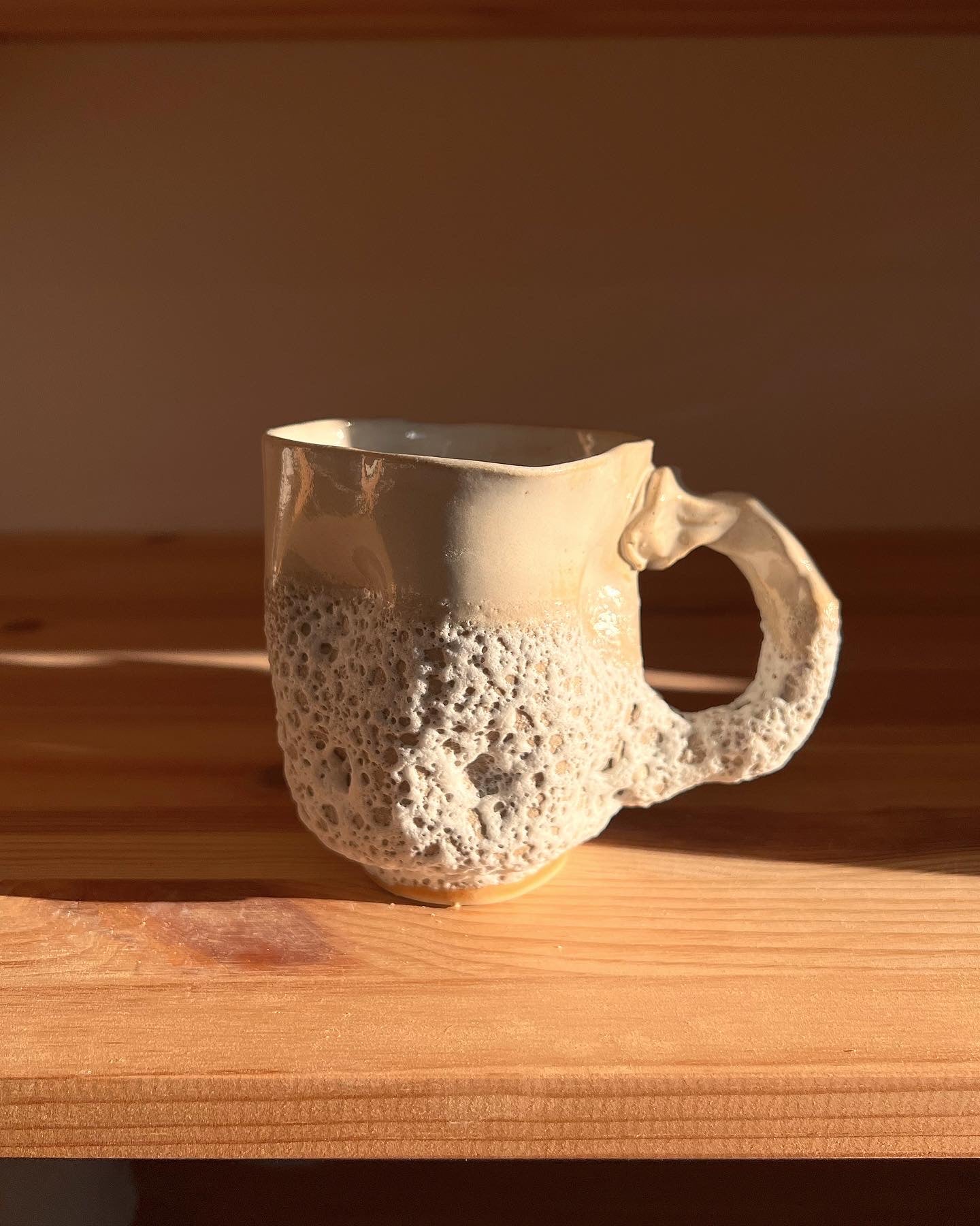 Curled sea foam cup with handle